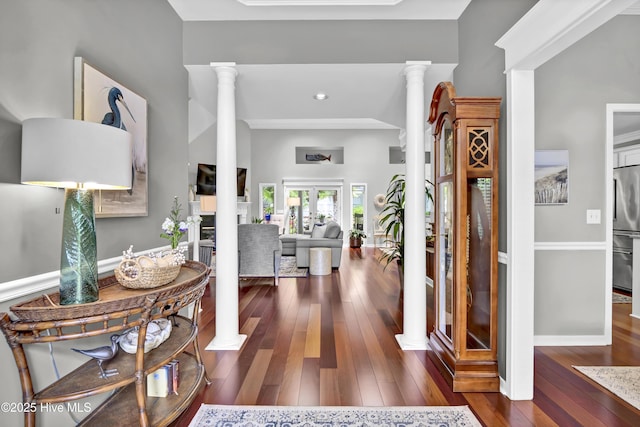 entrance foyer with decorative columns, hardwood / wood-style flooring, baseboards, and recessed lighting