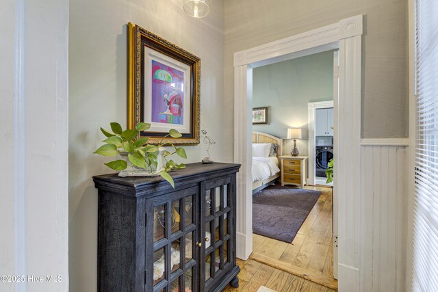 hallway with wood-type flooring