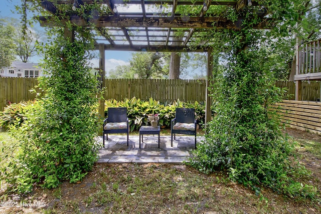 fenced backyard featuring a patio area and a pergola