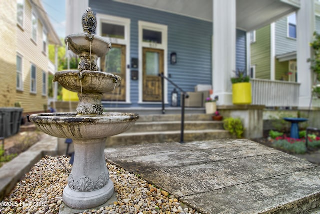doorway to property featuring a porch