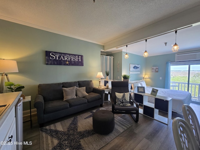 602 W Fort Macon Rd W Unit 138, Atlantic Beach, NC 28512 - living area featuring dark wood-style flooring, ornamental molding, and a textured ceiling