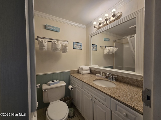 602 W Fort Macon Rd W Unit 138, Atlantic Beach, NC 28512 - bathroom featuring crown molding, toilet, vanity, a wainscoted wall, and a shower
