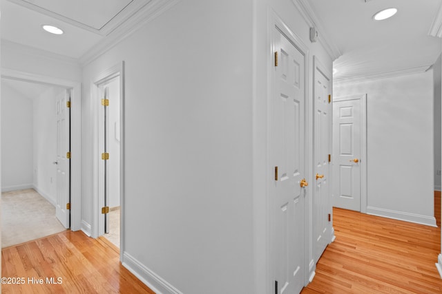 1103 Groppo Cv, Wilmington, NC 28412 - hallway with light wood finished floors, ornamental molding, recessed lighting, baseboards, and attic access