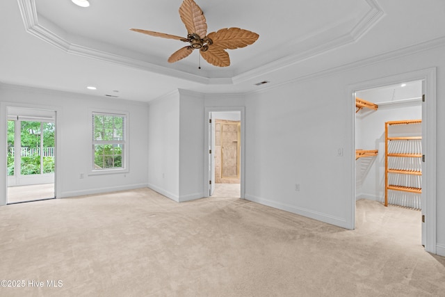 1103 Groppo Cv, Wilmington, NC 28412 - unfurnished room featuring attic access, a tray ceiling, ornamental molding, light carpet, and a ceiling fan