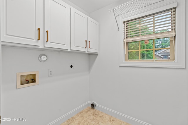 laundry room with cabinet space, hookup for a washing machine, baseboards, electric dryer hookup, and gas dryer hookup