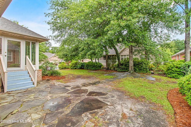 1103 Groppo Cv, Wilmington, NC 28412 - view of yard with entry steps and a patio