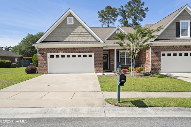 1271 Greensview Cir, Leland, NC 28451 - craftsman-style house featuring a front yard, driveway, brick siding, a shingled roof, and an attached garage