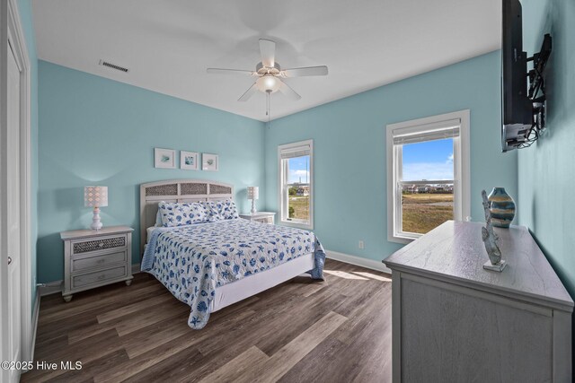 130 N Permuda Wynd Dr, North Topsail Beach, NC 28460 - bedroom with wood finished floors, baseboards, and a ceiling fan