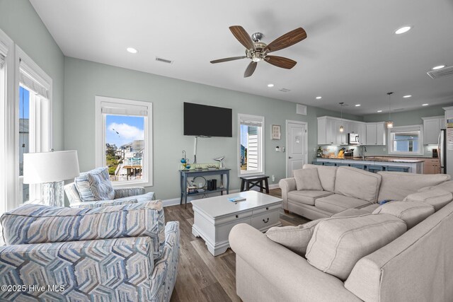 130 N Permuda Wynd Dr, North Topsail Beach, NC 28460 - living area featuring dark wood-style flooring, recessed lighting, a ceiling fan, and baseboards