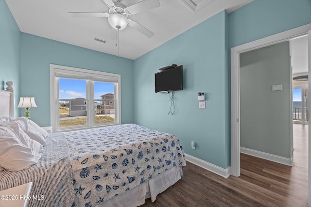 130 N Permuda Wynd Dr, North Topsail Beach, NC 28460 - bedroom with wood finished floors, multiple windows, baseboards, and a ceiling fan