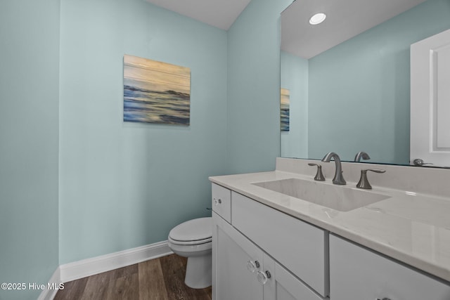 130 N Permuda Wynd Dr, North Topsail Beach, NC 28460 - bathroom with baseboards, toilet, wood finished floors, and vanity
