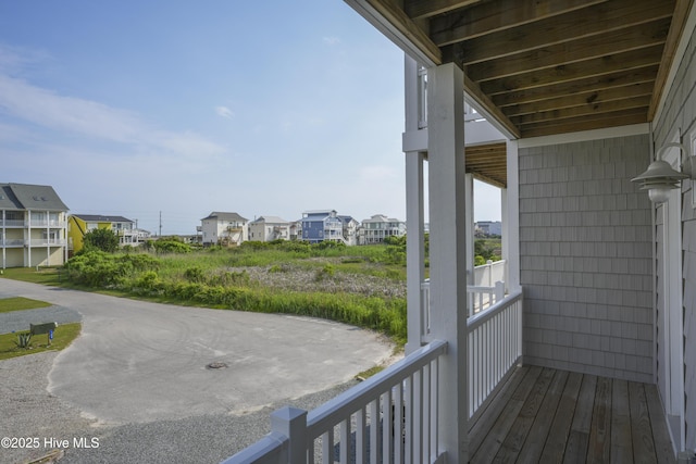 128 Sea Oaks Ct, North Topsail Beach, NC 28460 - wooden terrace featuring a residential view