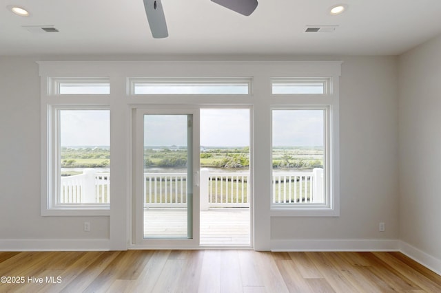 128 Sea Oaks Ct, North Topsail Beach, NC 28460 - entryway featuring healthy amount of natural light, light wood-style floors, recessed lighting, and baseboards