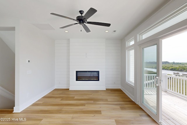 128 Sea Oaks Ct, North Topsail Beach, NC 28460 - unfurnished living room with a large fireplace, recessed lighting, light wood finished floors, baseboards, and ceiling fan