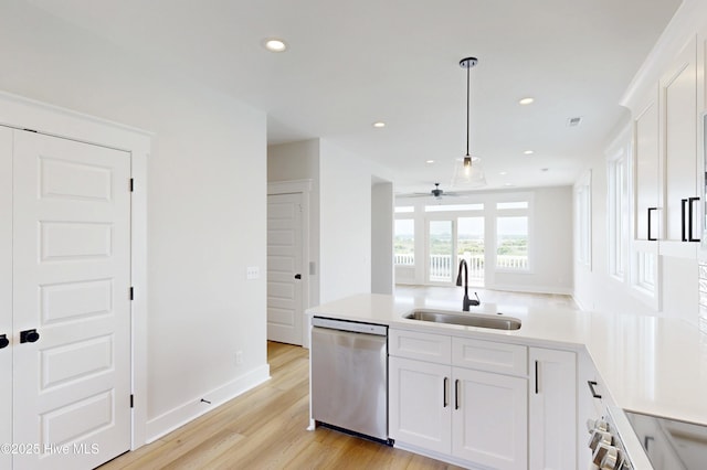 128 Sea Oaks Ct, North Topsail Beach, NC 28460 - kitchen with dishwasher, a sink, ceiling fan, white cabinets, and light countertops