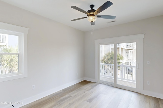 128 Sea Oaks Ct, North Topsail Beach, NC 28460 - spare room with baseboards, light wood-style floors, and a ceiling fan