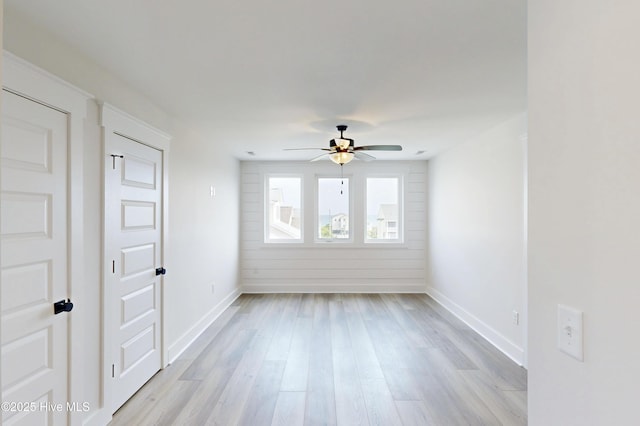 128 Sea Oaks Ct, North Topsail Beach, NC 28460 - spare room featuring a ceiling fan, baseboards, and light wood-type flooring