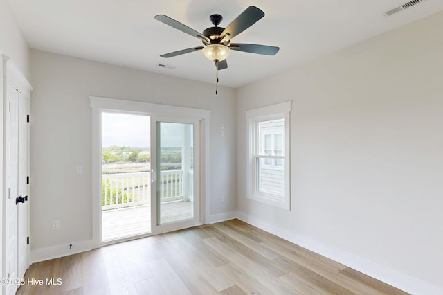 128 Sea Oaks Ct, North Topsail Beach, NC 28460 - empty room with light wood finished floors, baseboards, and a ceiling fan