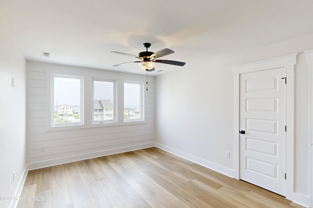 128 Sea Oaks Ct, North Topsail Beach, NC 28460 - unfurnished room with ceiling fan, baseboards, and light wood-style flooring