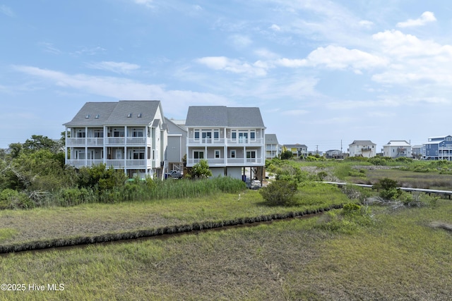 128 Sea Oaks Ct, North Topsail Beach, NC 28460 - rear view of house featuring a balcony