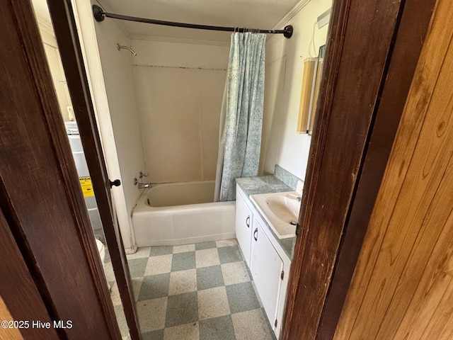 full bath featuring tile patterned floors, ornamental molding, shower / bath combo with shower curtain, and vanity