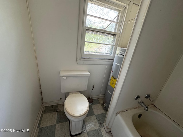 bathroom with tile patterned floors, toilet, electric water heater, and baseboards