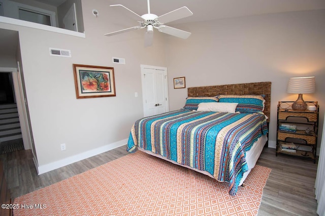 565 Salter Path Rd Unit S-5, Pine Knoll Shores, NC 28512 - bedroom featuring baseboards, a towering ceiling, wood finished floors, and ceiling fan