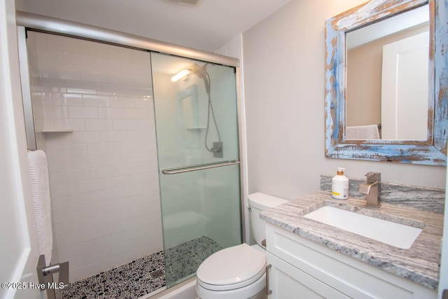 565 Salter Path Rd Unit S-5, Pine Knoll Shores, NC 28512 - bathroom with toilet, a shower stall, and vanity