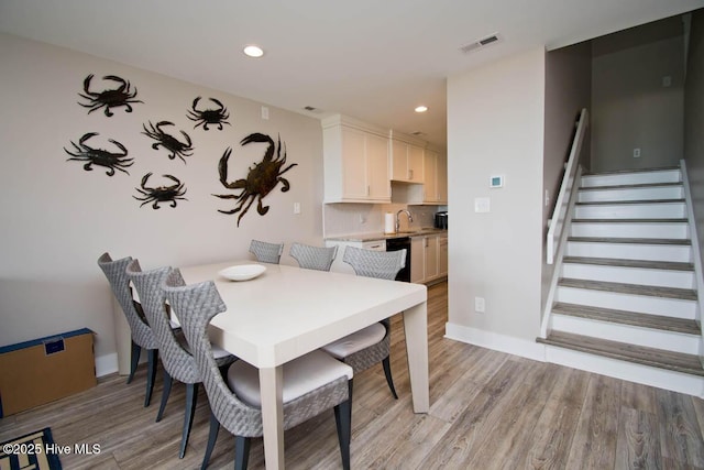 565 Salter Path Rd Unit S-5, Pine Knoll Shores, NC 28512 - dining space with light wood-style flooring, stairway, recessed lighting, and baseboards