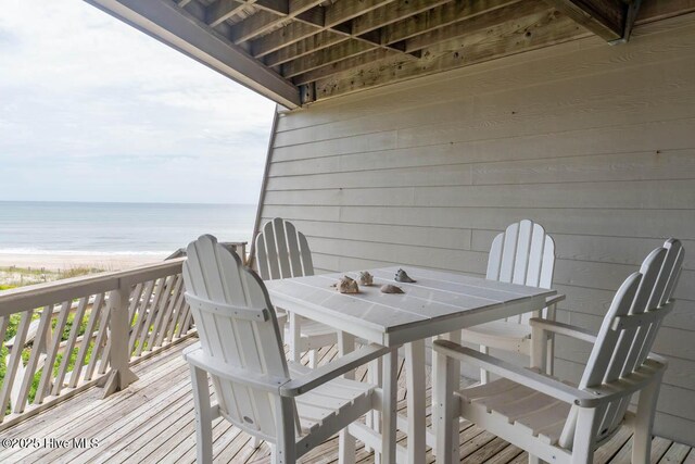 565 Salter Path Rd Unit S-5, Pine Knoll Shores, NC 28512 - wooden deck featuring view of water and beach and outdoor dining space