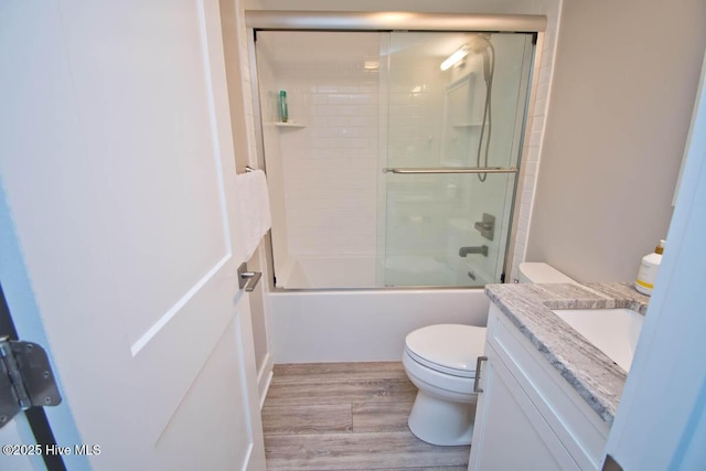 565 Salter Path Rd Unit S-5, Pine Knoll Shores, NC 28512 - full bath with toilet, wood finished floors, vanity, and shower / bath combination with glass door