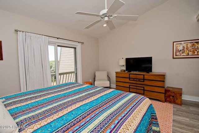 565 Salter Path Rd Unit S-5, Pine Knoll Shores, NC 28512 - bedroom with wood finished floors, baseboards, vaulted ceiling, a ceiling fan, and access to exterior