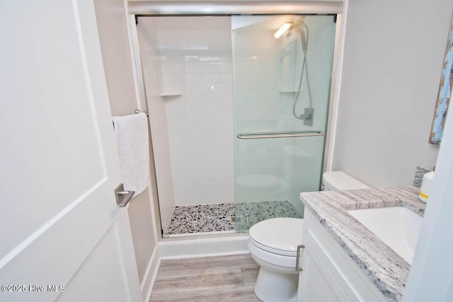 565 Salter Path Rd Unit S-5, Pine Knoll Shores, NC 28512 - full bath with toilet, a stall shower, vanity, and wood finished floors
