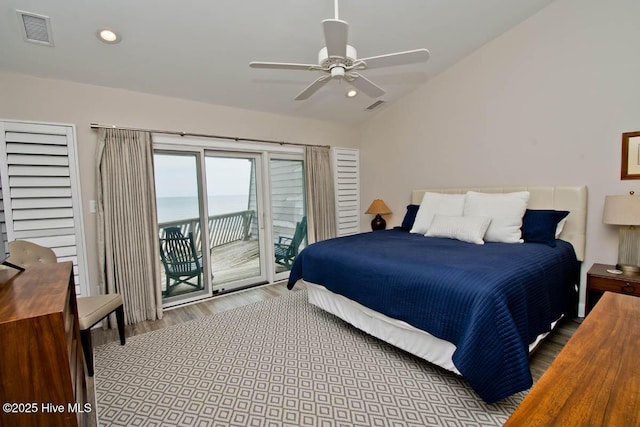 565 Salter Path Rd Unit S-5, Pine Knoll Shores, NC 28512 - bedroom with wood finished floors, access to exterior, vaulted ceiling, recessed lighting, and a water view