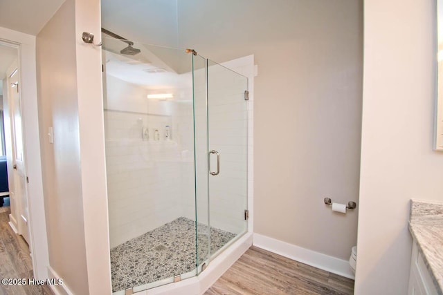 565 Salter Path Rd Unit S-5, Pine Knoll Shores, NC 28512 - full bathroom with wood finished floors, a stall shower, vanity, and toilet