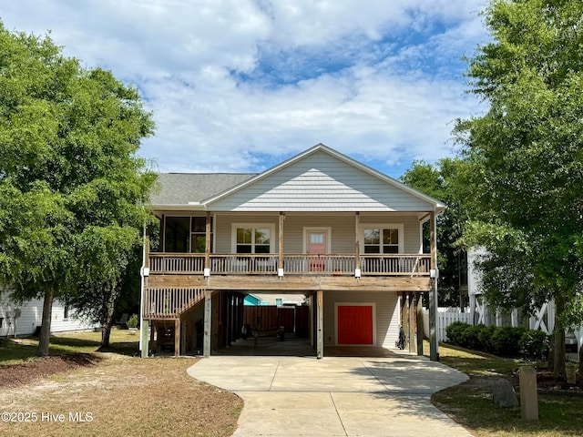 112 NW 20th St, Oak Island, NC 28465 - raised beach house with a carport and driveway