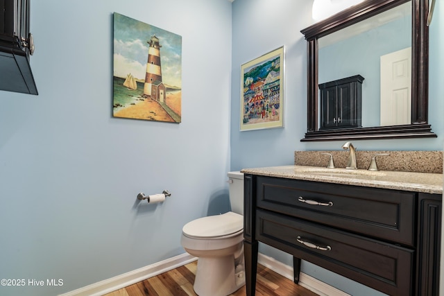 265 Creek View Dr, Sunset Beach, NC 28468 - half bath featuring wood finished floors, baseboards, toilet, and vanity