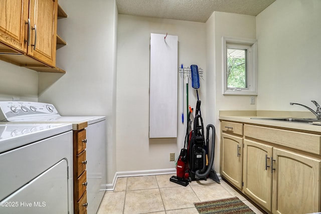 265 Creek View Dr, Sunset Beach, NC 28468 - laundry room with cabinet space, separate washer and dryer, baseboards, light tile patterned flooring, and a textured ceiling