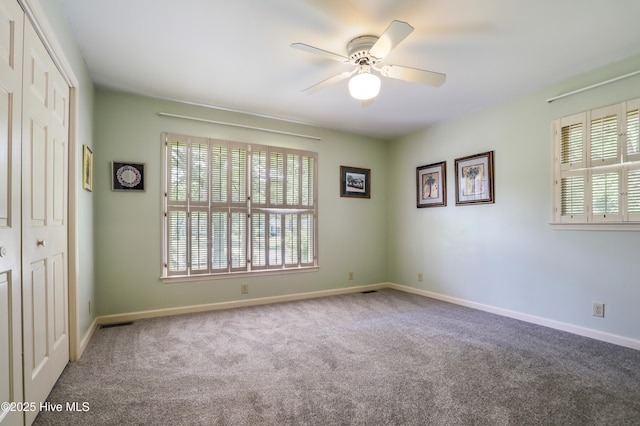 265 Creek View Dr, Sunset Beach, NC 28468 - spare room with a ceiling fan, carpet, and baseboards