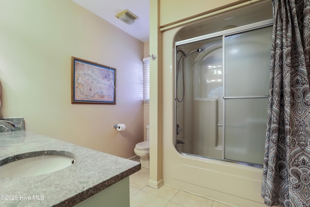 265 Creek View Dr, Sunset Beach, NC 28468 - full bathroom featuring tile patterned floors, combined bath / shower with glass door, vanity, and toilet
