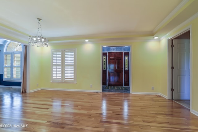 265 Creek View Dr, Sunset Beach, NC 28468 - spare room with a chandelier, light wood finished floors, crown molding, plenty of natural light, and baseboards