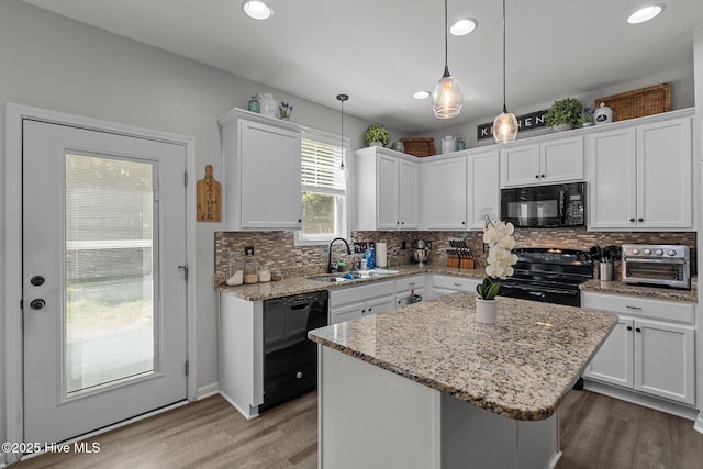 140 Timberwood Dr, Cameron, NC 28326 - kitchen featuring black appliances, a sink, wood finished floors, white cabinets, and recessed lighting