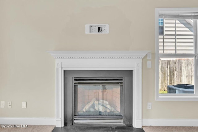 132 Turquoise Dr, Jacksonville, NC 28546 - detailed view of a fireplace with flush hearth, baseboards, and central air condition unit