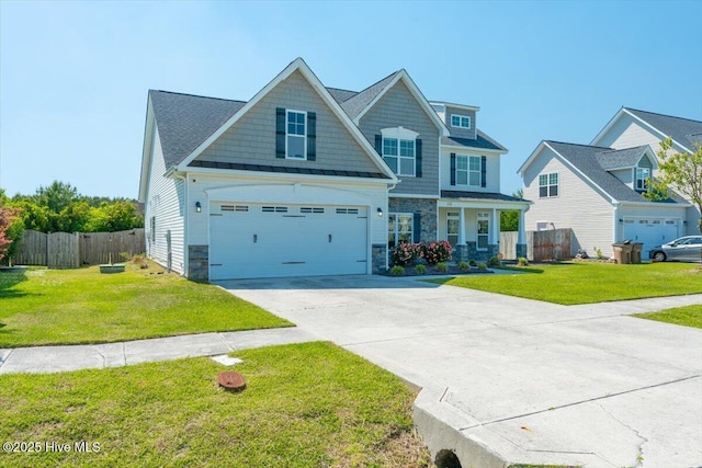 132 Turquoise Dr, Jacksonville, NC 28546 - craftsman-style house featuring stone siding, concrete driveway, and a garage
