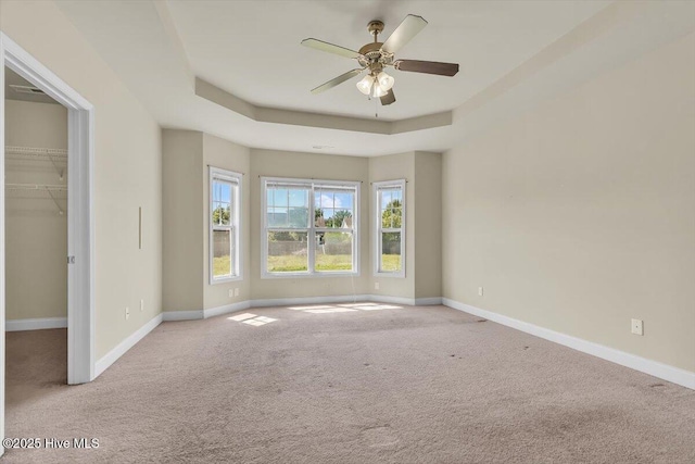 132 Turquoise Dr, Jacksonville, NC 28546 - carpeted spare room featuring baseboards, a ceiling fan, and a raised ceiling