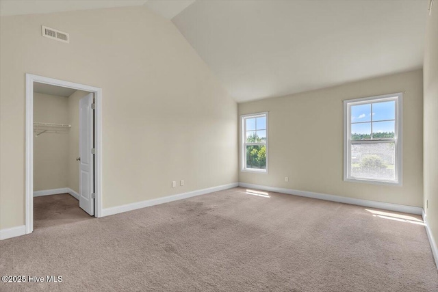 132 Turquoise Dr, Jacksonville, NC 28546 - unfurnished bedroom with vaulted ceiling, carpet, baseboards, and a walk in closet