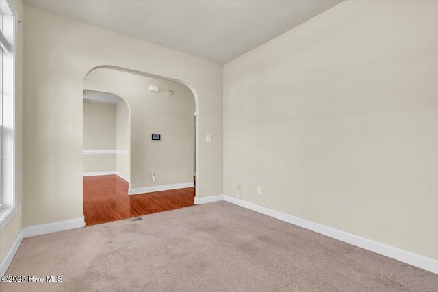 132 Turquoise Dr, Jacksonville, NC 28546 - carpeted spare room with arched walkways and baseboards