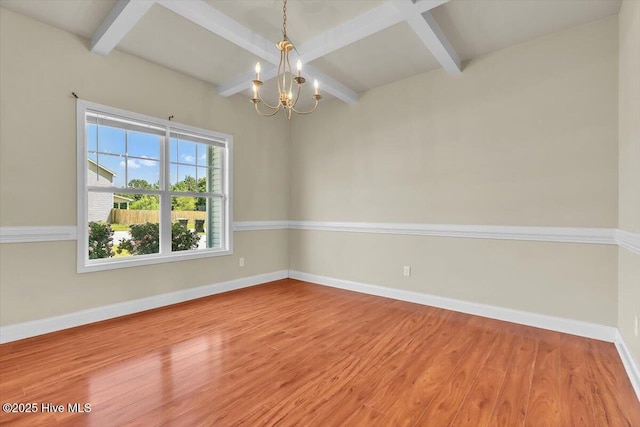 132 Turquoise Dr, Jacksonville, NC 28546 - empty room with a chandelier, wood finished floors, beam ceiling, baseboards, and coffered ceiling