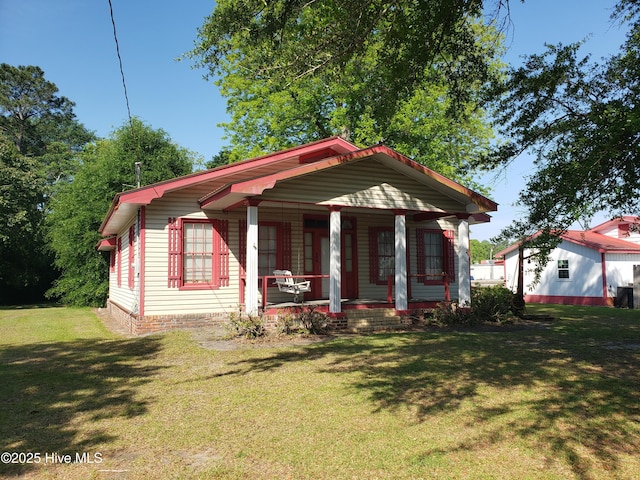 809 Conway Rd, Fair Bluff, NC 28439 - view of front facade with a front yard and covered porch