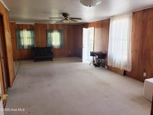 809 Conway Rd, Fair Bluff, NC 28439 - carpeted living room with wooden walls and ceiling fan